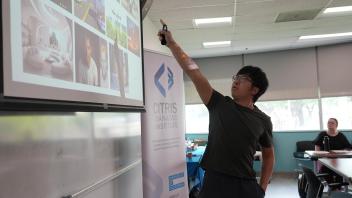 Prof. Yubei Chen presenting on AI and its Impact on Education 
