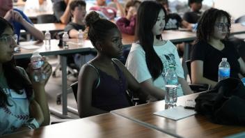 Participants engrossed in listening to the presenter