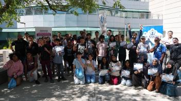 Group picture in front of Kemper Courtyard after completing the workshop with their certificates