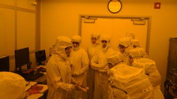 Inside the yellow photolithography room of semiconductor fabrication lab - Photolithography is writing on stone using light