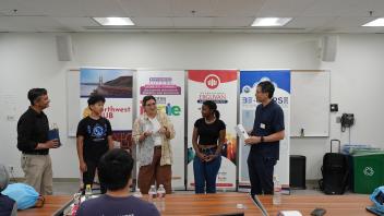 Participant being recognized for outstanding contribution to the workshop