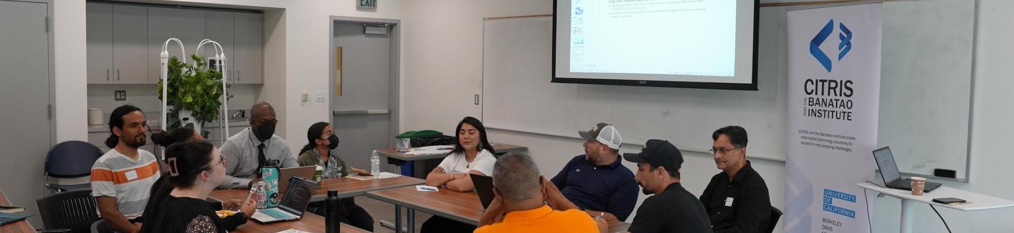 High school teachers and mentors participating in a roundtable discussion for a brainstorming session raising awareness about Chips and Science Act focusing on  broader semiconductor microelectronic fields. 